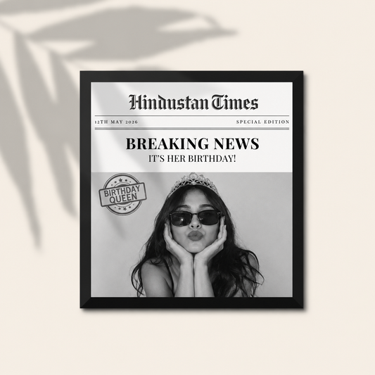 Personalized newspaper front page photo frame with custom headline, date and photo in a premium black frame, ideal for birthdays and special occasions.